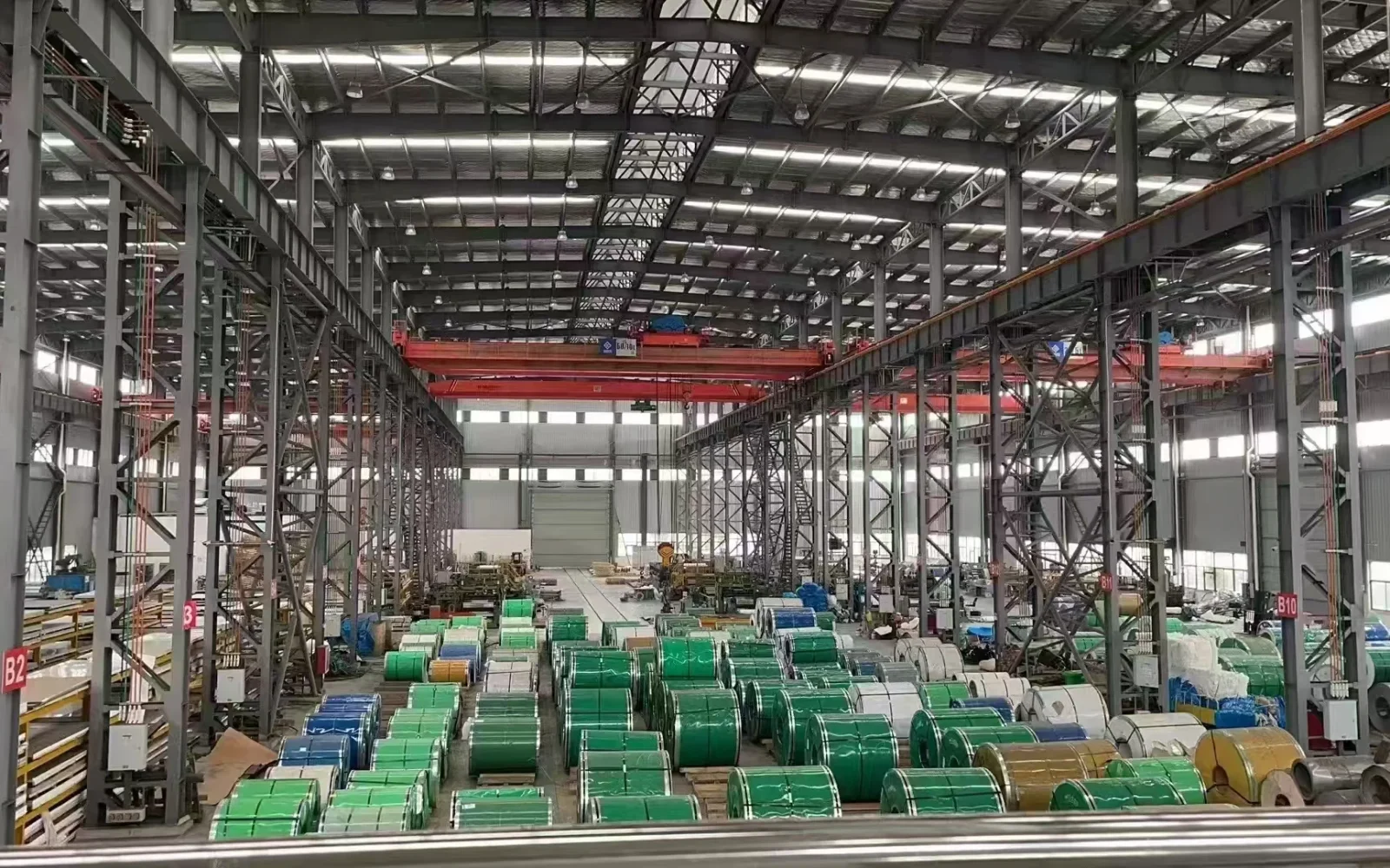 Rows of stainless steel coils inside a processing facility