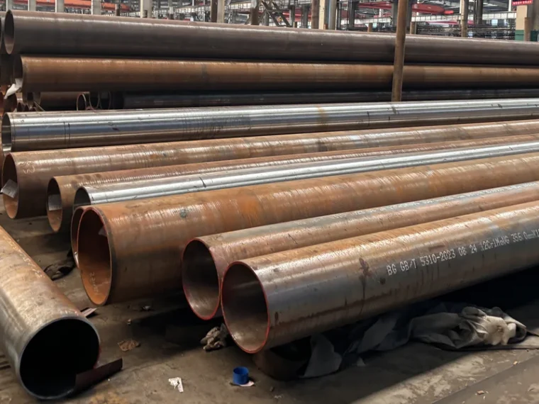 Carbon steel pipes arranged for material handling
