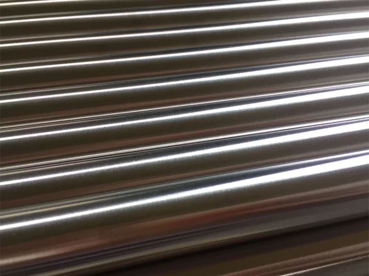 Polished stainless steel round bars arranged in parallel